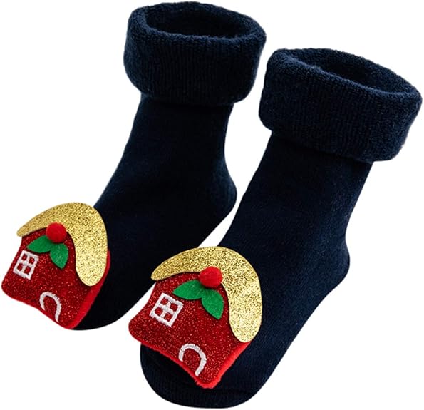 A Pair Of Blue Christmas Baby Socks With Gingerbread House Design In A White Background