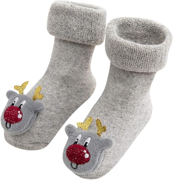 A Pair Of Gray Christmas Baby Socks With Reindeer Design In A White Background