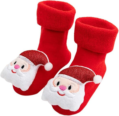 A Pair Of Red Christmas Baby Socks With Santa Clause Design In A White Background