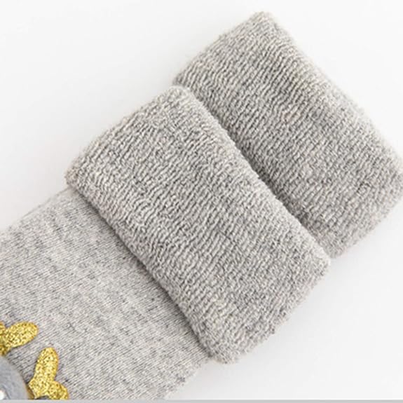 Close Up Photo Of Gray Christmas Baby Sock's Ankle cuff In A White Background