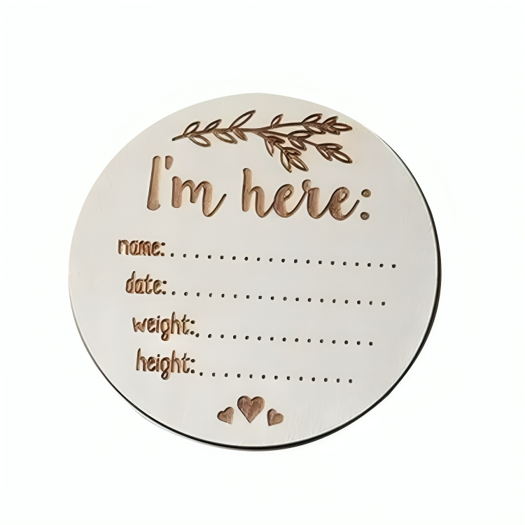 Round birth announcement sign with fields for name, date, weight, and height on a white background.