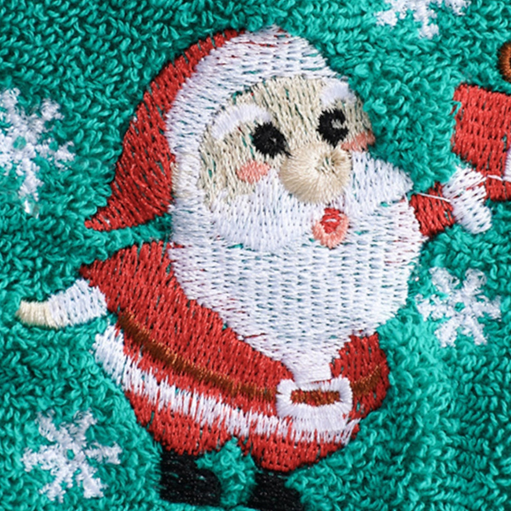 Close-up Of Green Christmas Baby Towel With Embroidered Santa Clause Design 