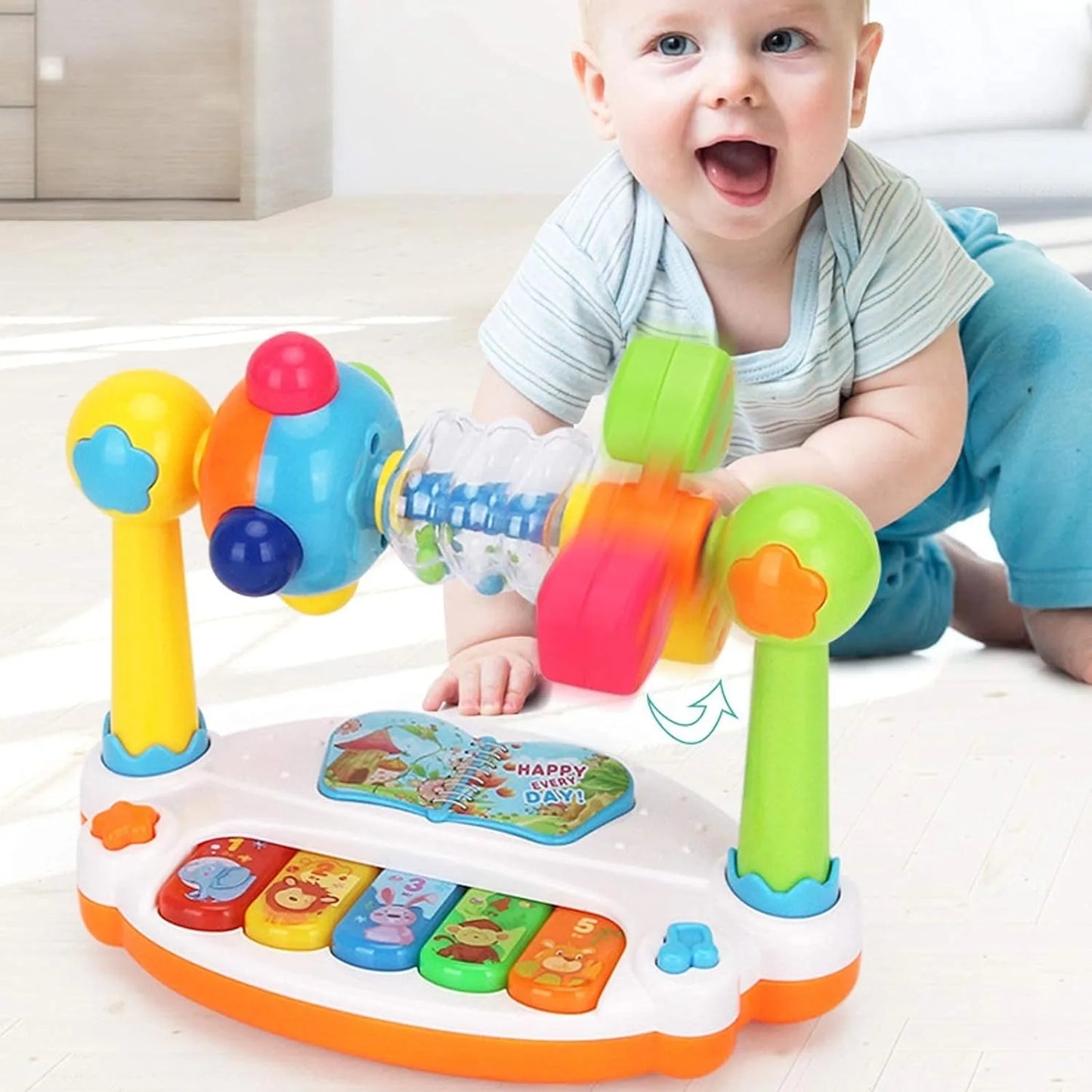 A baby playing with a colorful toy activity center on the floor.