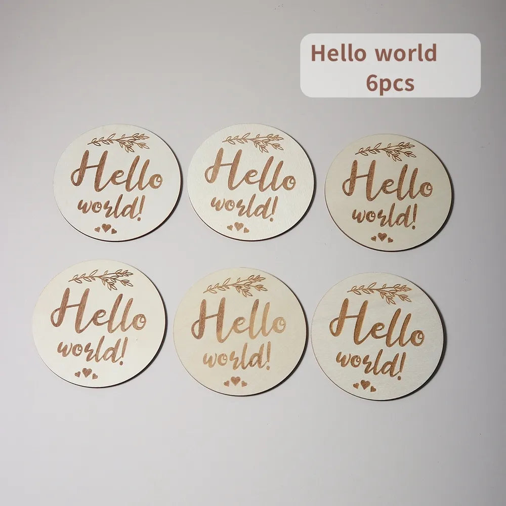 Six wooden coasters with Hello world! text, leaf motifs, and a label saying 6pcs.