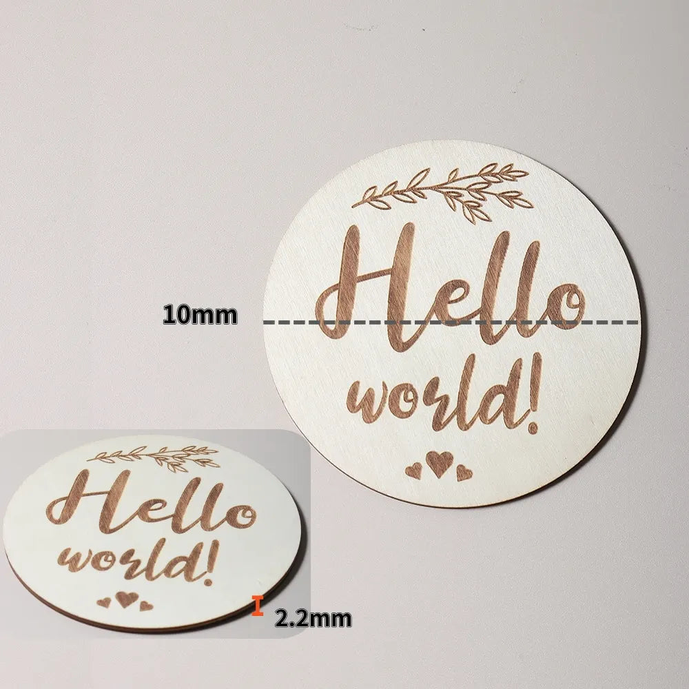 Wooden disc with Hello world! burned into it, showing dimensions of 10mm thickness and 2.2mm edge.