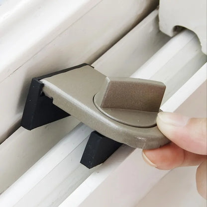 A Person Inserting a Sliding window lock on the side of sliding window