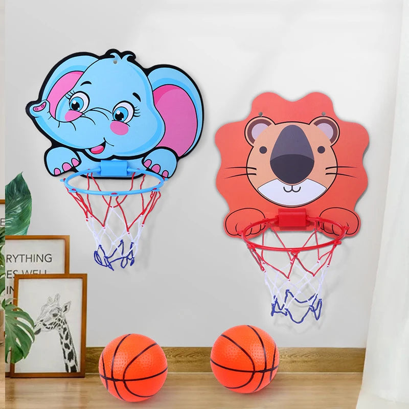 Cartoon elephant and tiger basketball hoops mounted on a wall, with two basketballs on the floor.