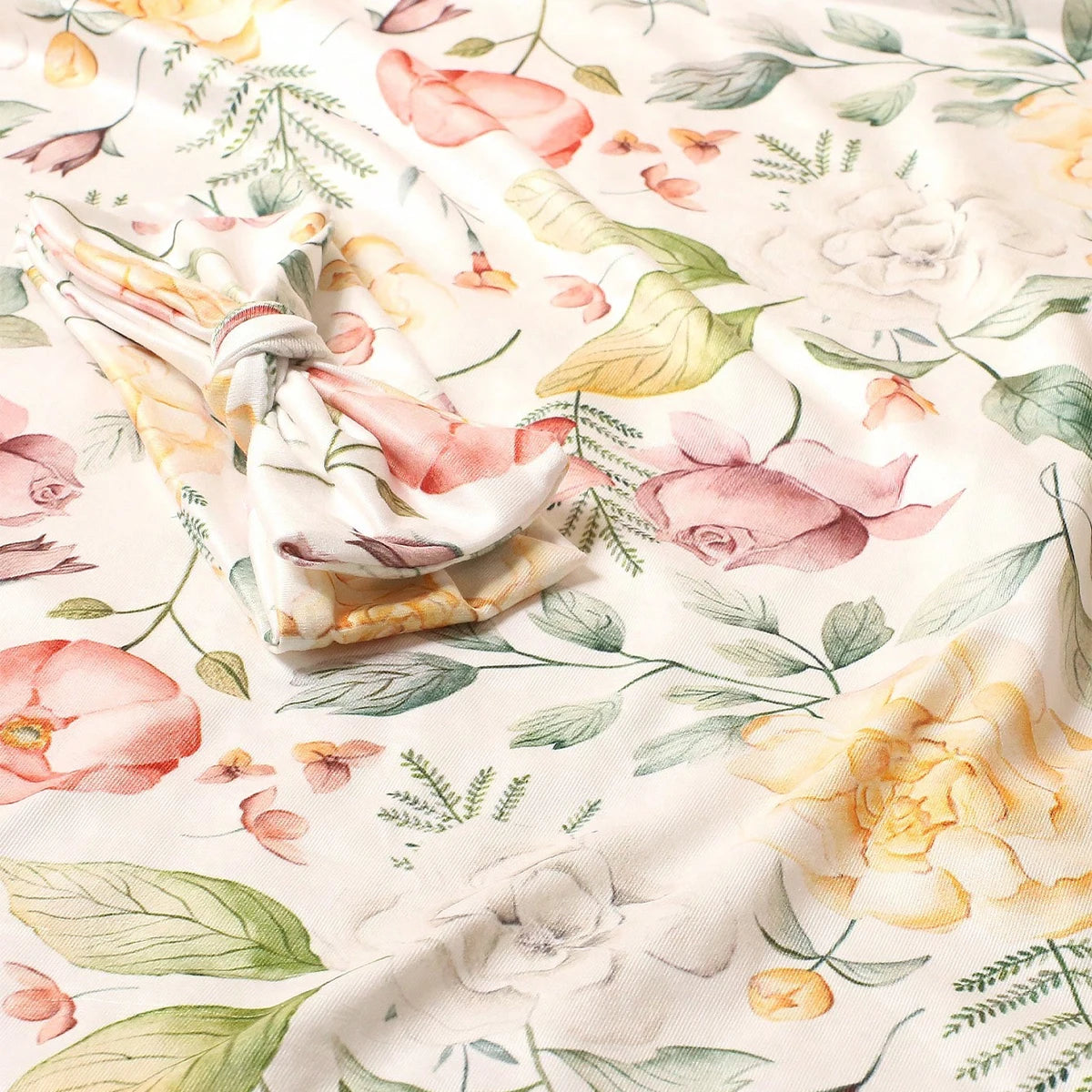 Fabric with floral pattern and a folded section in the center.