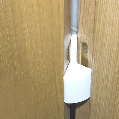 Door stopper finger pinch guard hanged in a door hinge