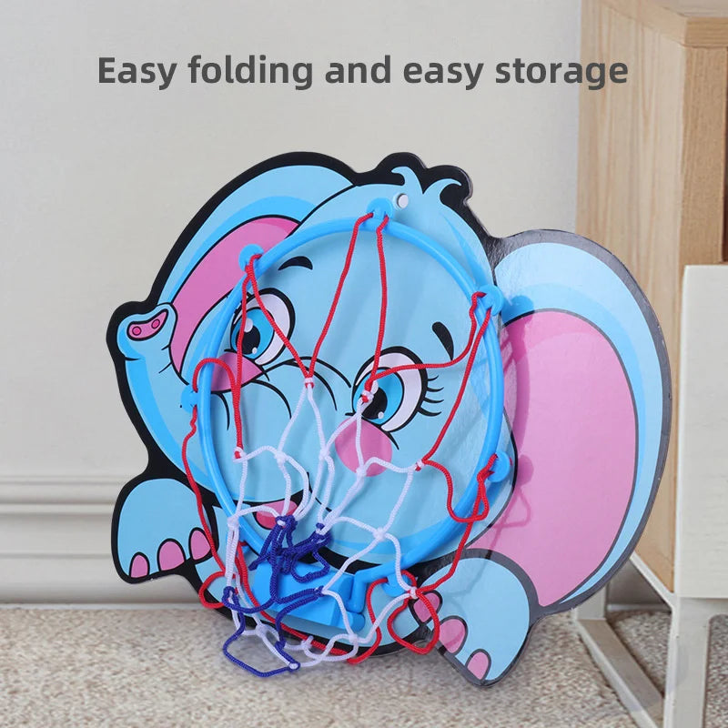 Foldable elephant-themed storage basket with shoes inside, placed against a wall.