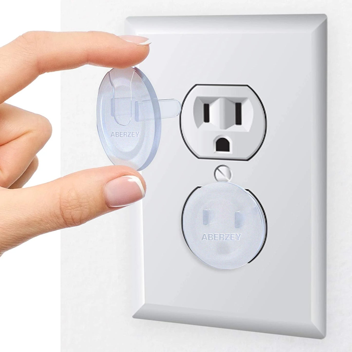 A person is holding a white outlet cover with a plug, demonstrating electrical safety and home improvement