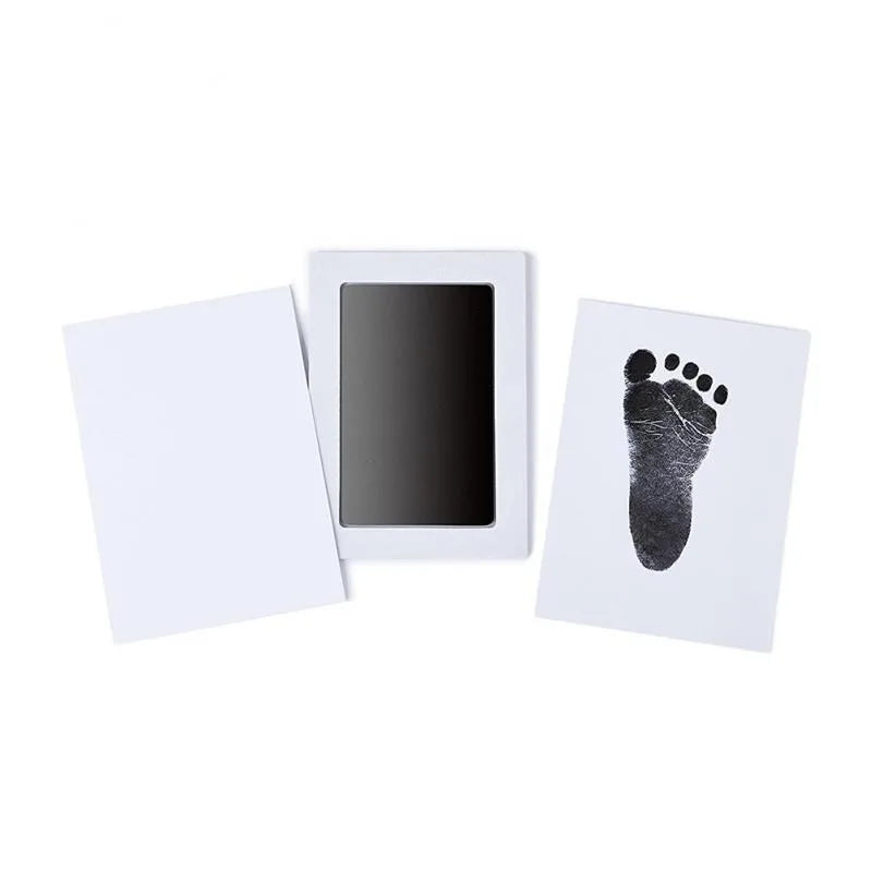 Three cards on a white surface, one with a black footprint, one blank, and one with a smartphone.