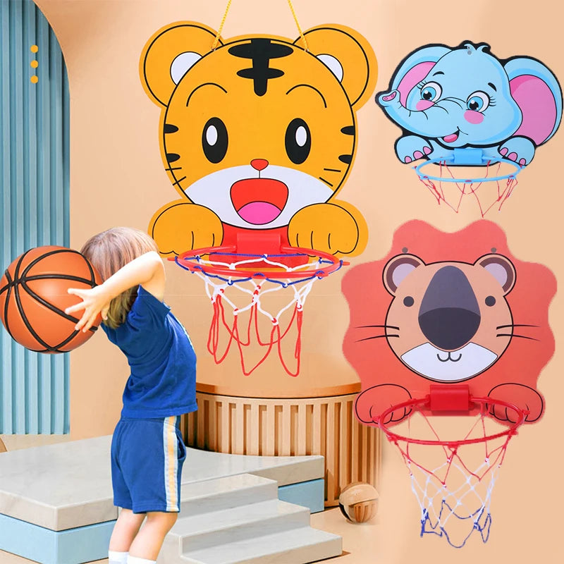 Child playing with basketball hoops designed as cartoon animals on a colorful wall.